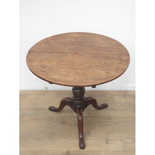 338 - A Georgian elm Pillar Table with two plank circular top on barrel turned column and tripod base 2ft ... 