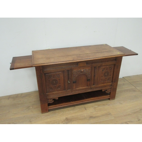 366 - An antique oak Cupboard with pair of carved panels flanking an arcaded cupboard door above lower she... 