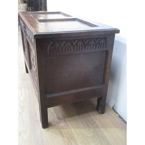 378 - A 17th Century oak Coffer with two panel sunken lid and arched frieze with two diamond carved front ... 