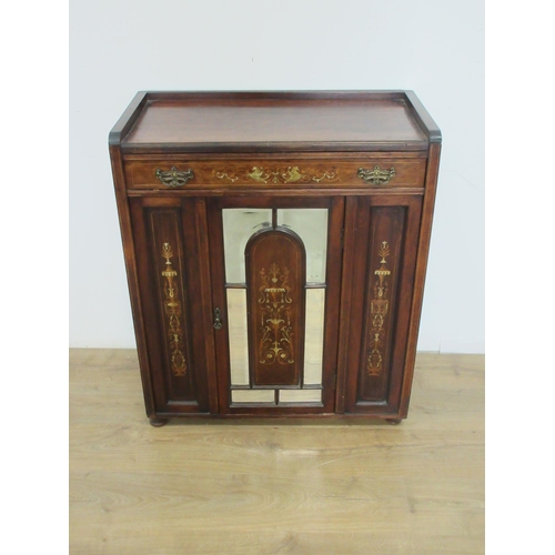 387 - An Edwardian Rosewood Cabinet with marquetry inlay, fitted frieze drawer above a mirror panelled doo... 