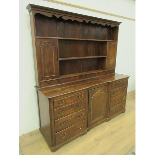 39 - An 18th Century oak Dresser and rack the upper section fitted pair of cupboard doors and six drawers... 