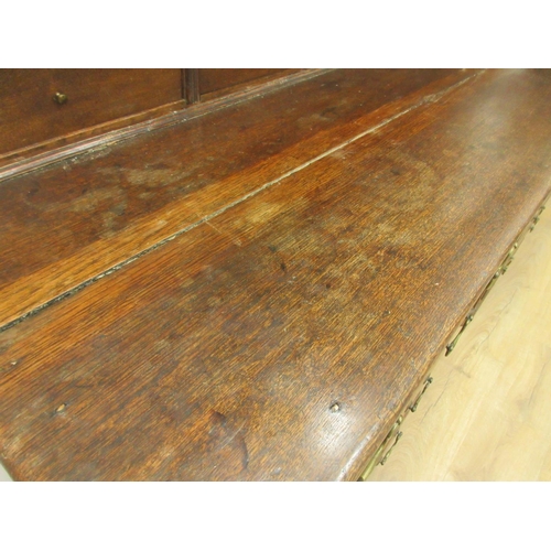 39 - An 18th Century oak Dresser and rack the upper section fitted pair of cupboard doors and six drawers... 