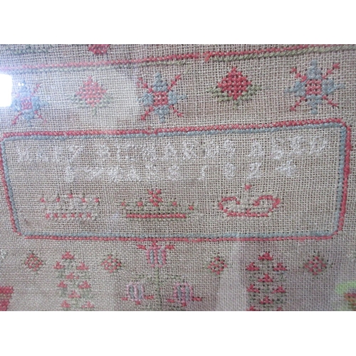 391 - A framed Sampler with stylised flowers and alphabet design 20 x 17in