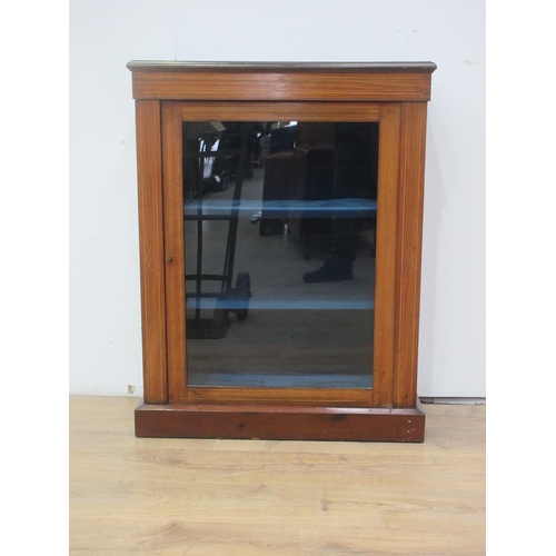 423 - A Victorian walnut veneered and inlaid Music Cabinet fitted single glazed door on plinth base 3ft 3i... 