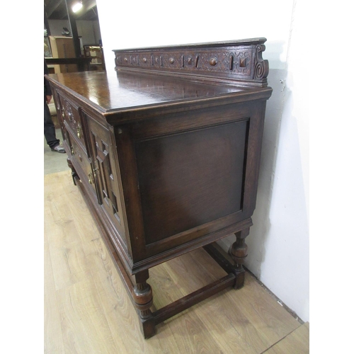 426 - A 20th Century moulded oak Sideboard fitted pair of cupboard doors flanking two drawers 6ft W x 3ft ... 