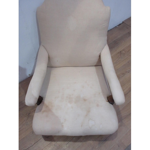 450 - A Howard style upholstered low Armchair with turned front supports