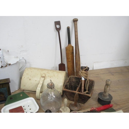 452 - A box of various items including a miniature Cricket bat, a rounders Bat, an enamel Watering Can, a ... 