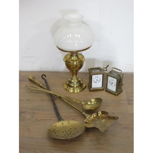 479 - A small brass Oil Lamp, brass Skimmer, brass Ladle, Shovel, and two brass carriage Clocks