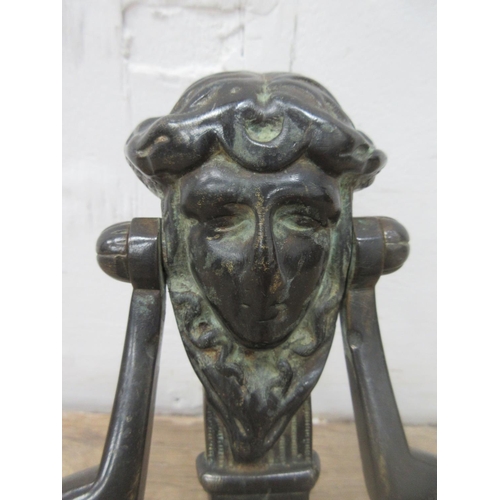 507 - A French Empire style cast metal Door Knocker in the form of a female Mask 8 1/2in