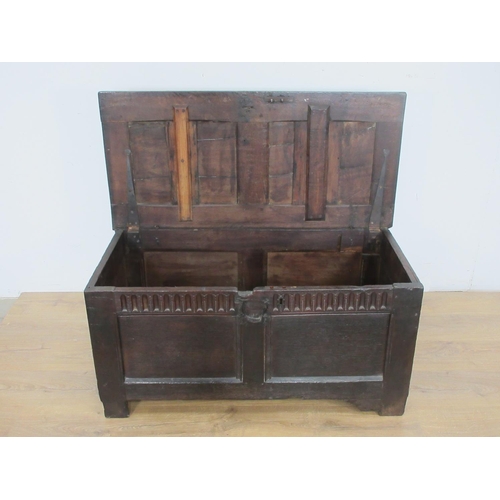 525 - A 17th Century oak Coffer with two sunken two panel lid above nulled frieze and two panel front 3ft ... 