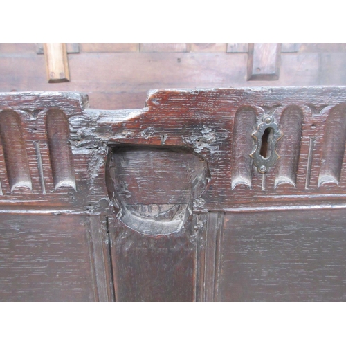 525 - A 17th Century oak Coffer with two sunken two panel lid above nulled frieze and two panel front 3ft ... 