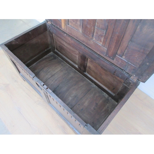 525 - A 17th Century oak Coffer with two sunken two panel lid above nulled frieze and two panel front 3ft ... 