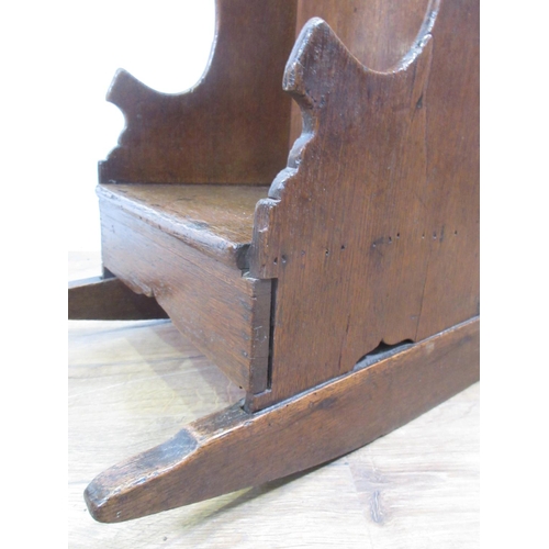 549 - An 18th Century oak wing backed child's Rocking Chair with pierced heart to back panel 2ft 1in H x 1... 