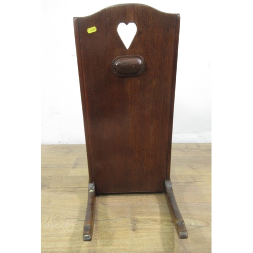 549 - An 18th Century oak wing backed child's Rocking Chair with pierced heart to back panel 2ft 1in H x 1... 