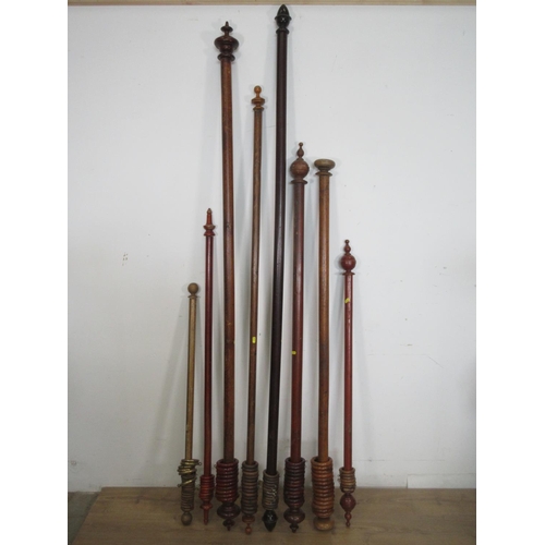 557 - Eight wooden Curtain Poles with rings