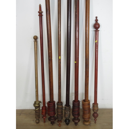 557 - Eight wooden Curtain Poles with rings