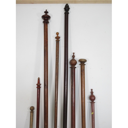 557 - Eight wooden Curtain Poles with rings