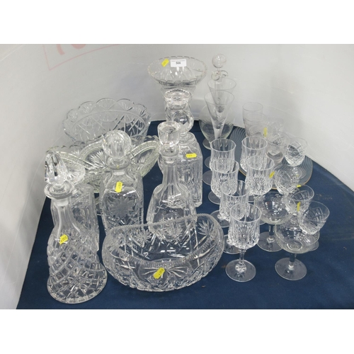 566 - A collection of cut glass including seven Decanters, three Bowls, a Vase and pedestal Glasses