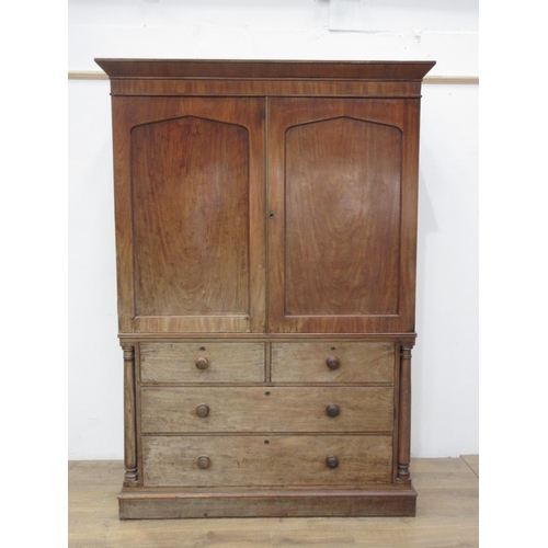 628 - A 19th Century mahogany Linen Press fitted pair of cupboard doors above base of two short and two lo... 