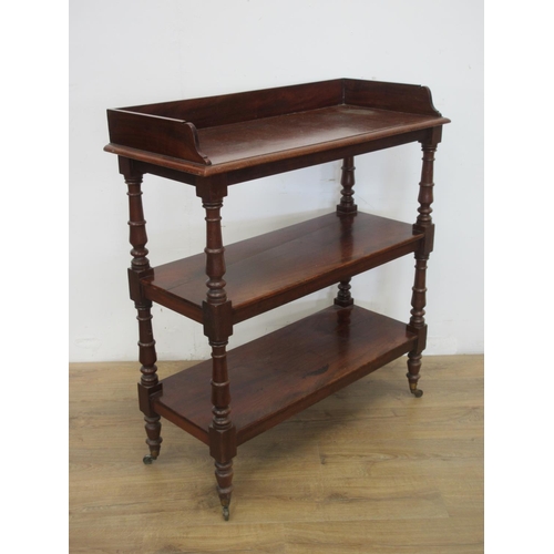 651 - A Victorian mahogany three tier Buffet on turned supports and brass casters 3ft 7in H x 3ft 2in W