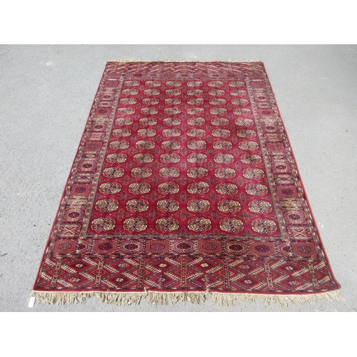 658 - A Tubris Super Rug on red ground with multiple borders with all over central lozenge designs 11ft 6i... 