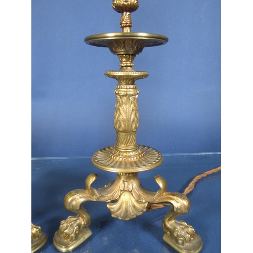 75 - A pair of 19th Century Rococo style ormolu Candlesticks converted to electricity on paw feet 1ft 3in... 