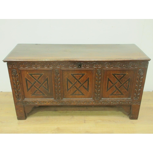 89 - A 17th Century oak Coffer with moulded plank top above lunette carved frieze and three marquetry inl... 