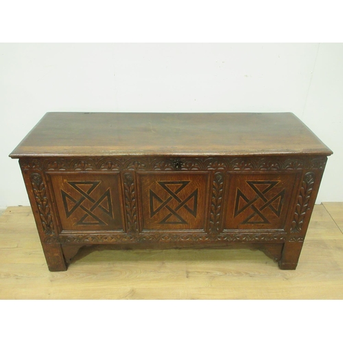 89 - A 17th Century oak Coffer with moulded plank top above lunette carved frieze and three marquetry inl... 