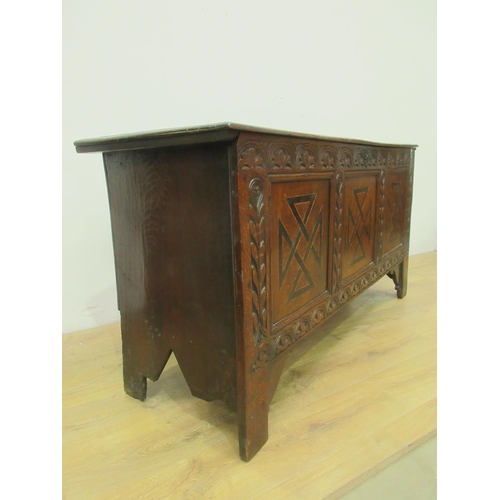 89 - A 17th Century oak Coffer with moulded plank top above lunette carved frieze and three marquetry inl... 