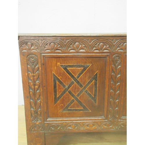 89 - A 17th Century oak Coffer with moulded plank top above lunette carved frieze and three marquetry inl... 