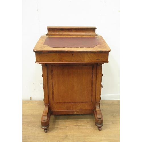 94 - A Victorian walnut veneered and inlaid Davenport fitted a bank of four drawers and four dummy drawer... 