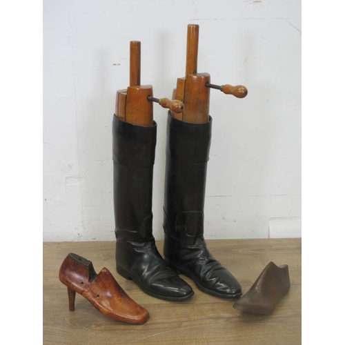 544 - A pair of antique black leather Riding Boots with wooden Trees and two wooden ladies Shoe trees