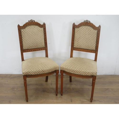 652 - A pair of 19th Century beech French Salon Chairs with beige upholstered backs and seats