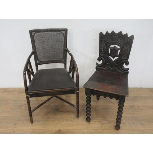 654 - A Victorian carved oak Hall Chair and a bamboo Elbow Chair