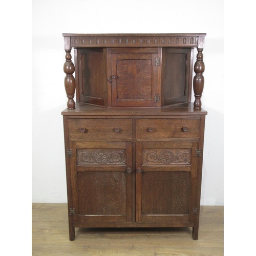 663 - An Oak reproduction Court Cupboard fitted single cupboard above two drawers 3ft W 4ft 7ins H