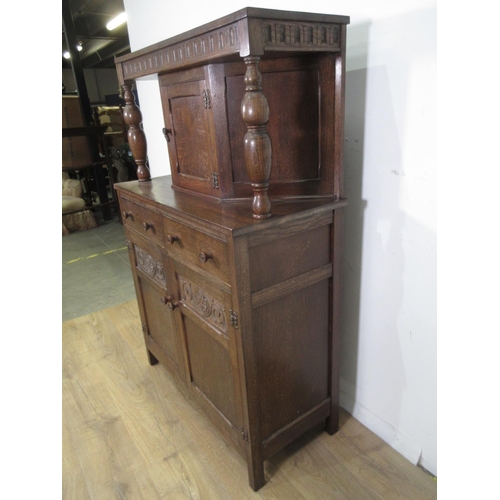 663 - An Oak reproduction Court Cupboard fitted single cupboard above two drawers 3ft W 4ft 7ins H