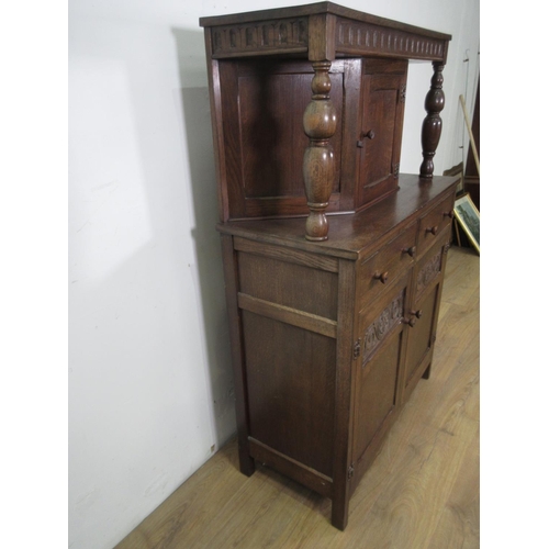 663 - An Oak reproduction Court Cupboard fitted single cupboard above two drawers 3ft W 4ft 7ins H