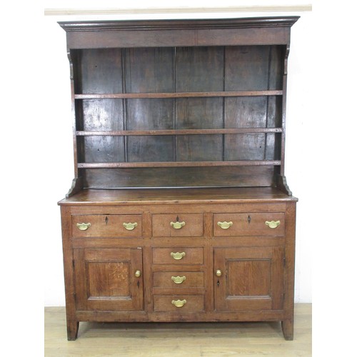 642 - An 18th Century oak Dresser and rack the base fitted three frieze drawers above a pair of cupboard d... 