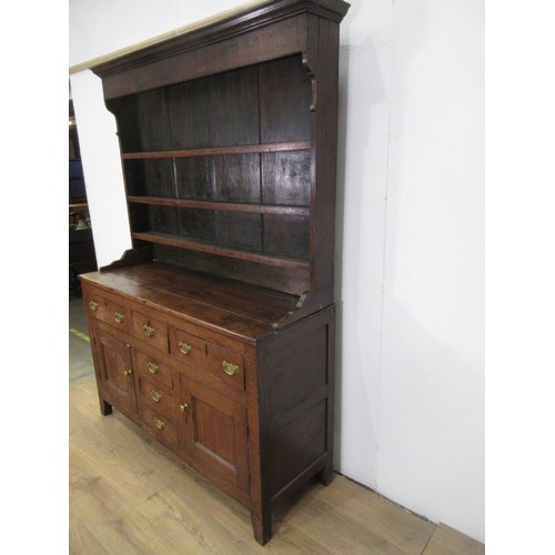 642 - An 18th Century oak Dresser and rack the base fitted three frieze drawers above a pair of cupboard d... 