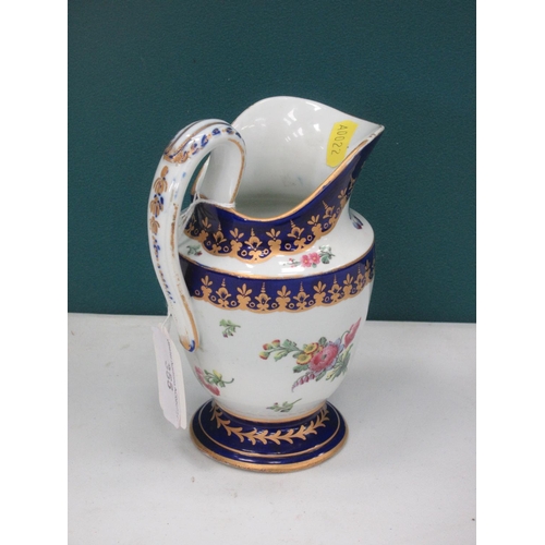 355 - A Tournai helmet shape Cream Jug with floral decoration in coloured enamels with blue and gilt rim, ... 