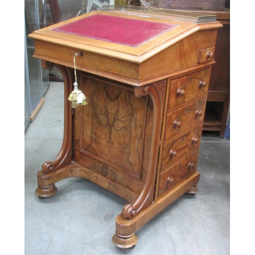 367 - A Victorian walnut Davenport with leather inset writing surface fitted small drawer above four drawe... 