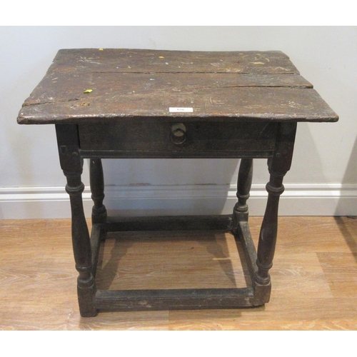 650 - A 17th Century joined oak Side Table with two plank top above frieze drawer mounted upon baluster tu... 