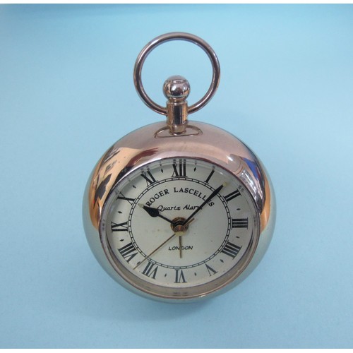 221 - A Roger Lascelles quartz Travel Alarm Clock in the form of a pocket watch in silver plated case