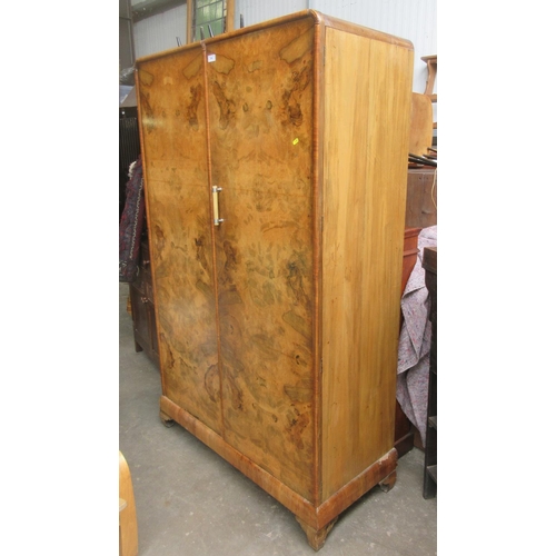 664 - A walnut two door Wardrobe enclosing hanging space (one handle missing) 3ft 10 W 6ft 2H