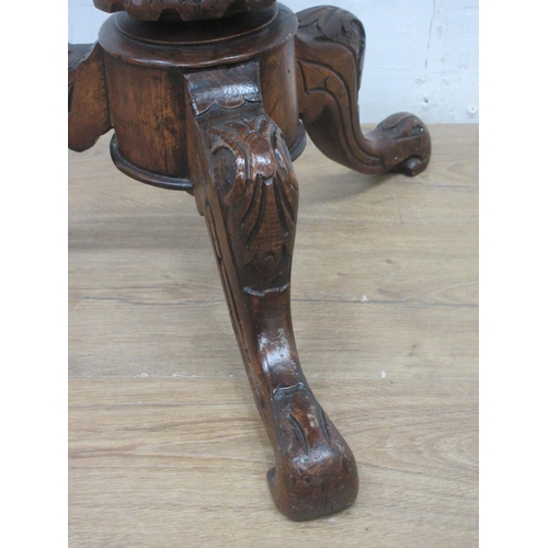 518 - A Victorian carved oak revolving Piano stool with needlework top 1ft 6in H