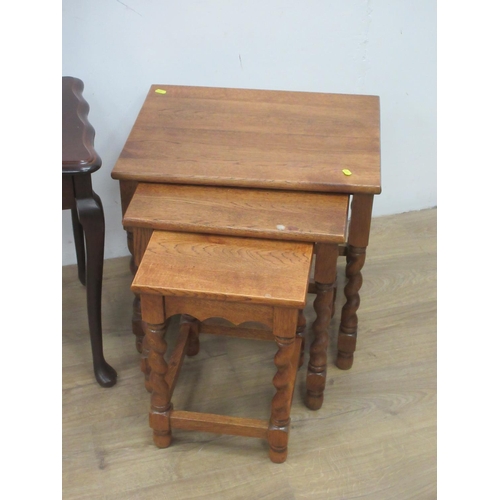 521 - A walnut two-tier Stand 1ft 3in W, a mahogany Torchiere on barley twist supports, a nest of three oa... 