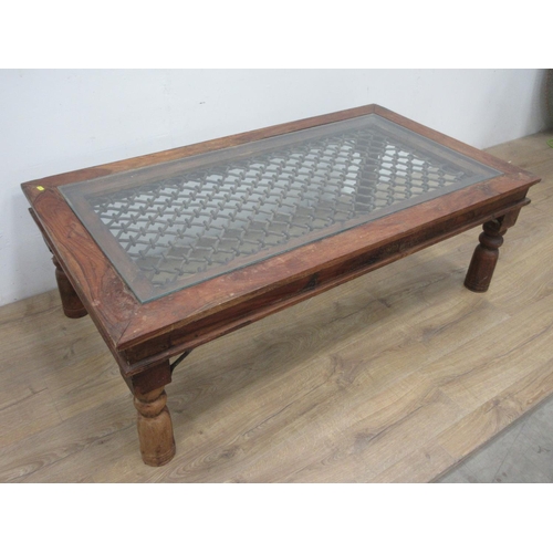 526 - A hardwood glass topped Coffee Table 4ft 6in W x 1ft 6in H