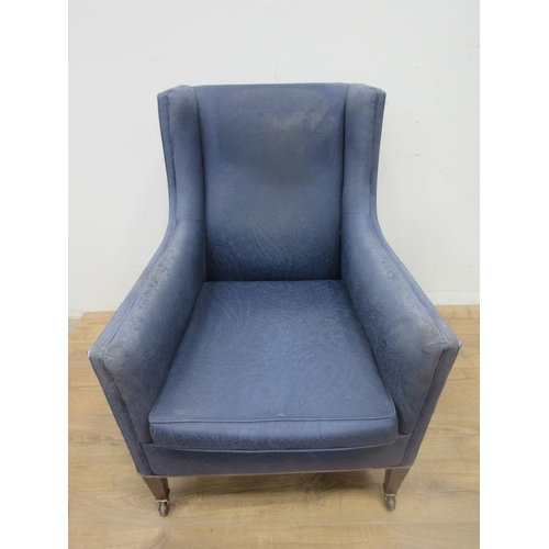 532 - An Edwardian blue upholstered Wingback Armchair 3ft 2in H and another on square cut tapering support... 