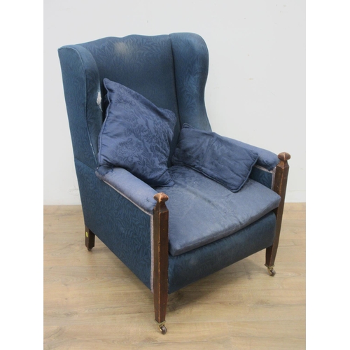 532 - An Edwardian blue upholstered Wingback Armchair 3ft 2in H and another on square cut tapering support... 