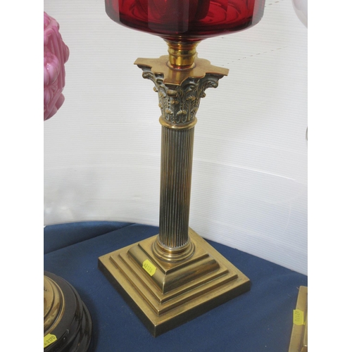 588 - Three brass Oil Lamps with glass reservoirs and shades